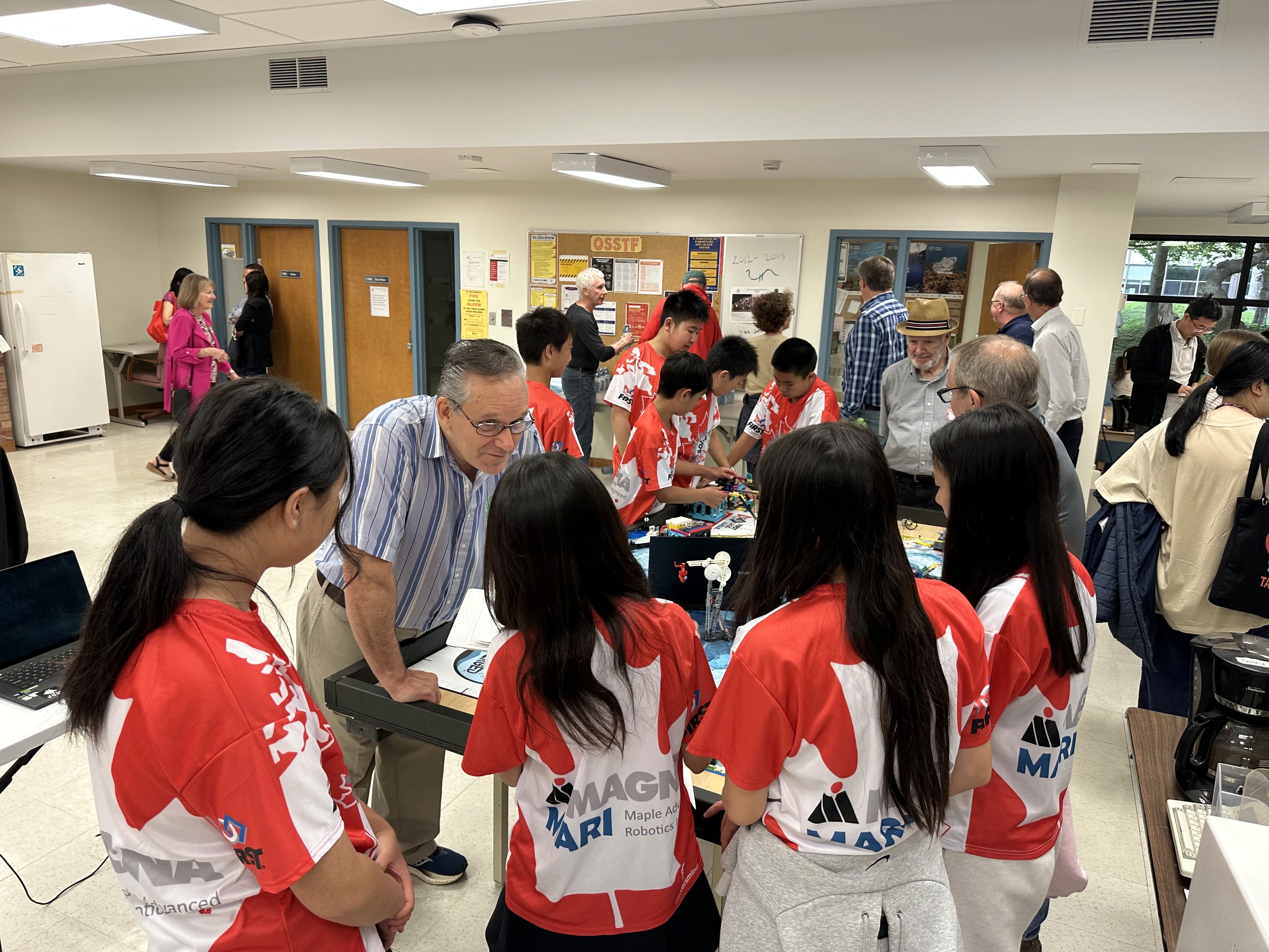 Renee Zhang from FLL team Solvers of X & Y showcases their Innovation Project to Alumni of Dr. G.W. Williams SS