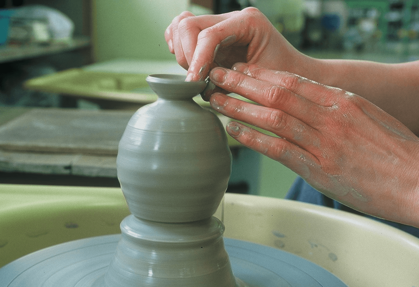 Swordsmiths hammering iron in a team