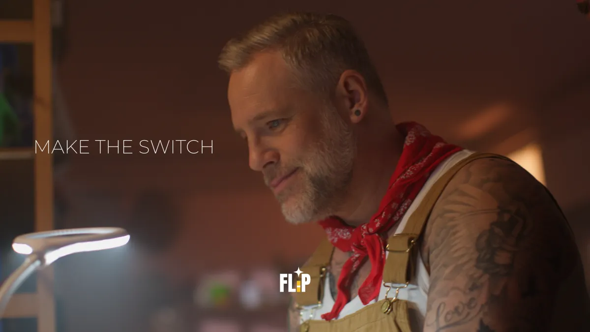 A commercial portrait of a man in overalls with the "MAKE THE SWITCH" text and company logo.