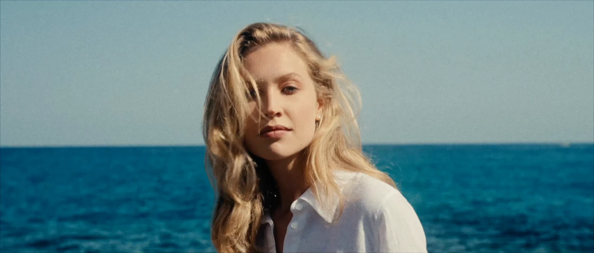 Model beside the sea in bright summer light