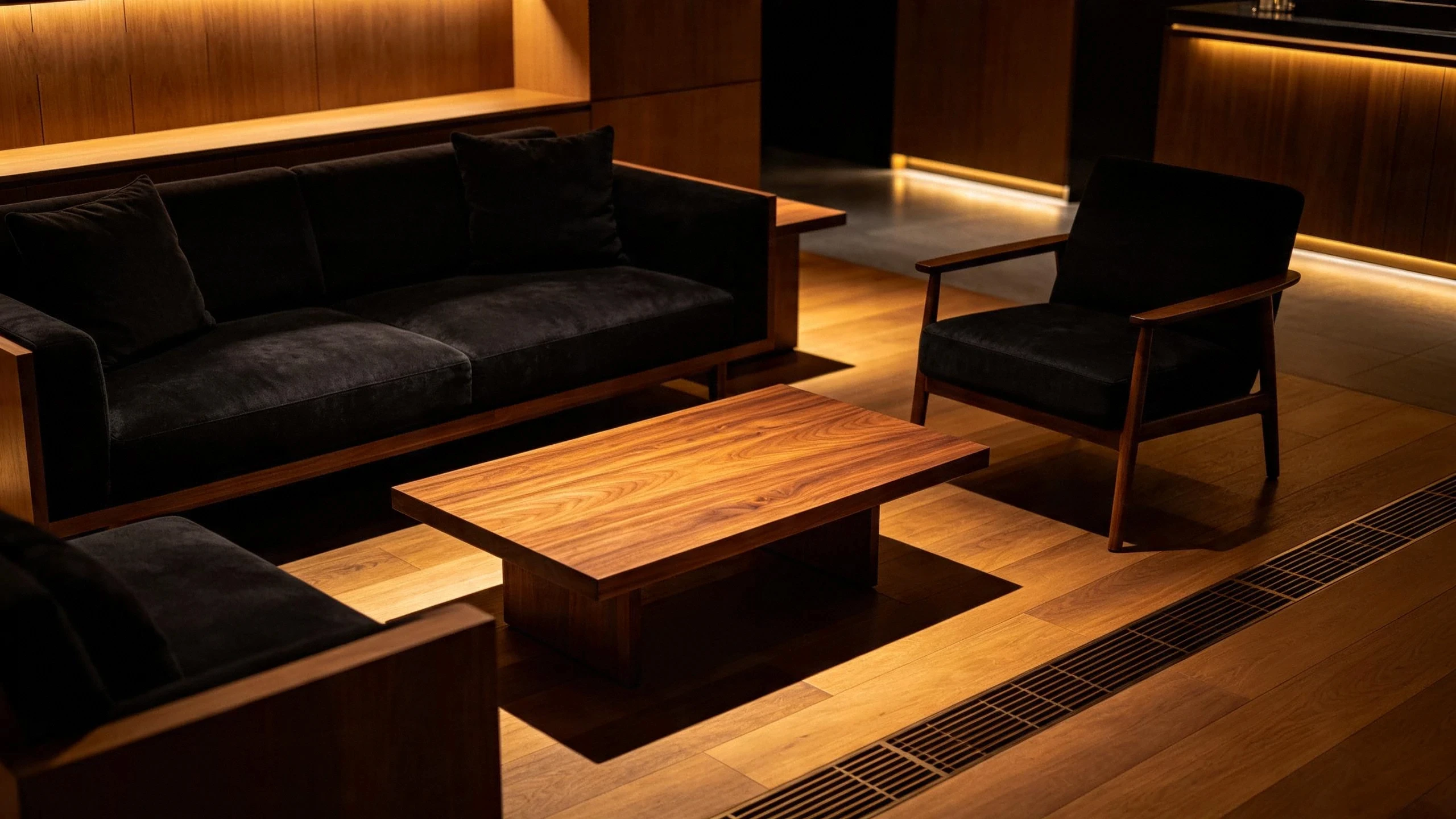 Minimal furniture against a shadowed wall