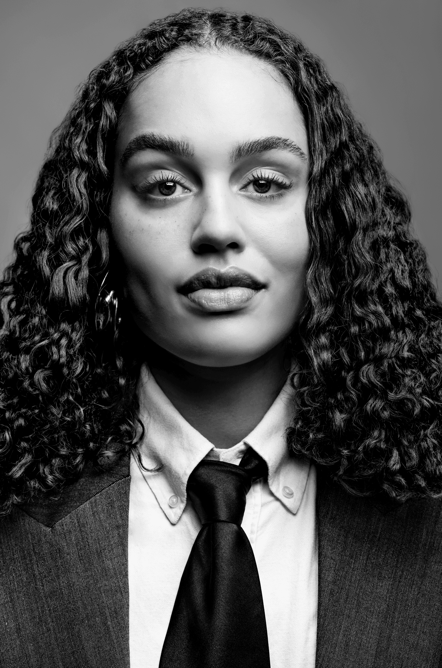 Snow-capped mountains viewed through a car window.