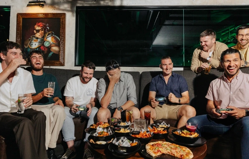 Group of people sitting at a cocktail table in the Tavern