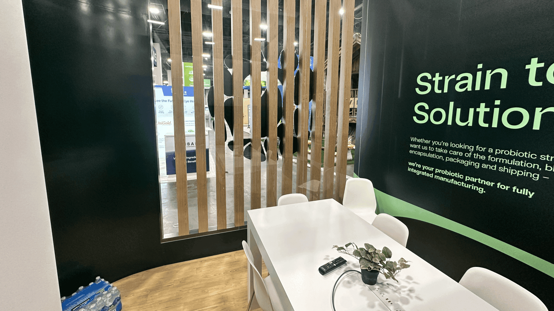 Exterior view of the meeting room showing visibility through the wooden slats into the private space.