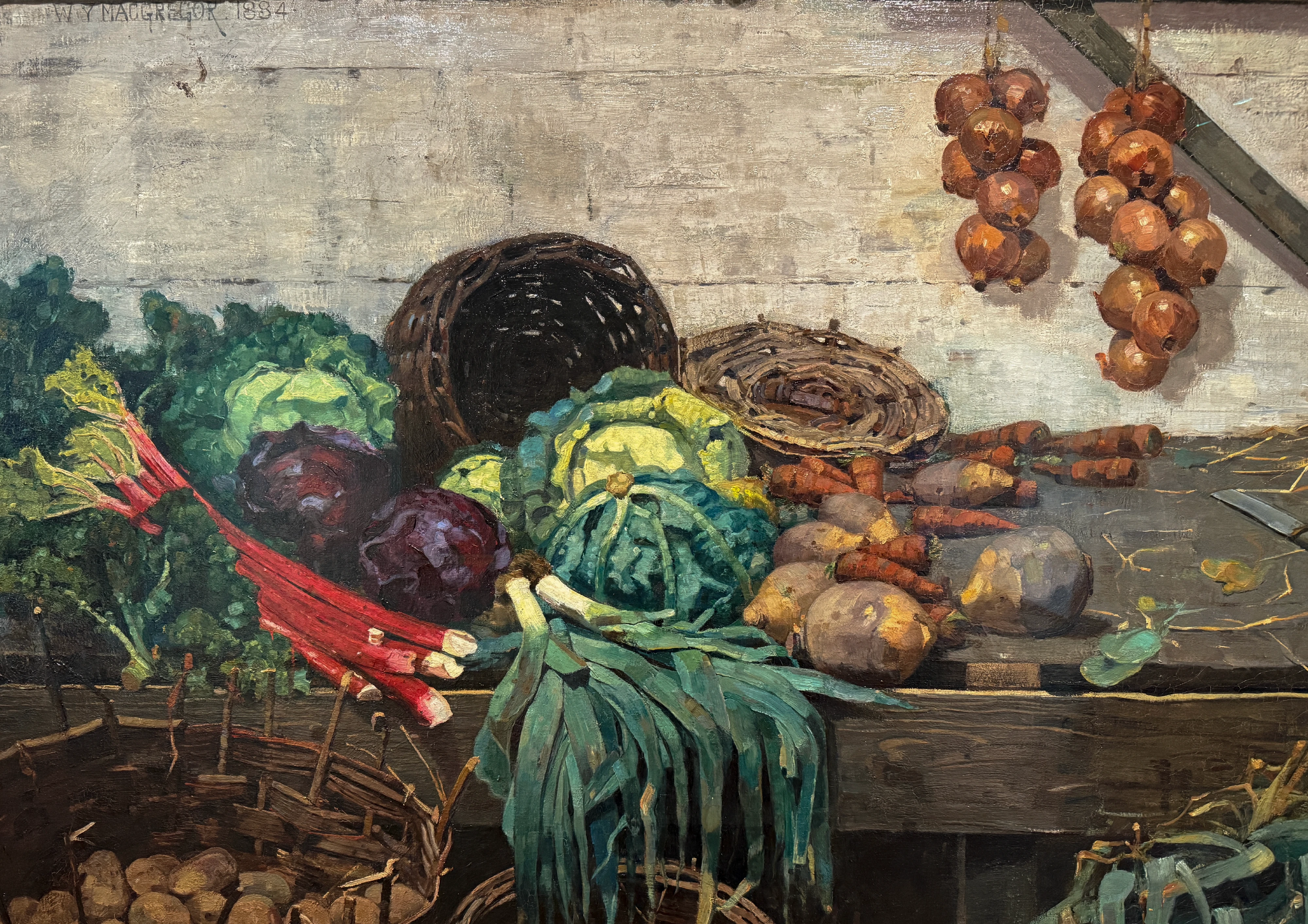 Painting of a market stall piled with vegetables: red-stemmed chard, cabbages, a dark basket, onions hanging above, in muted earthy tones.