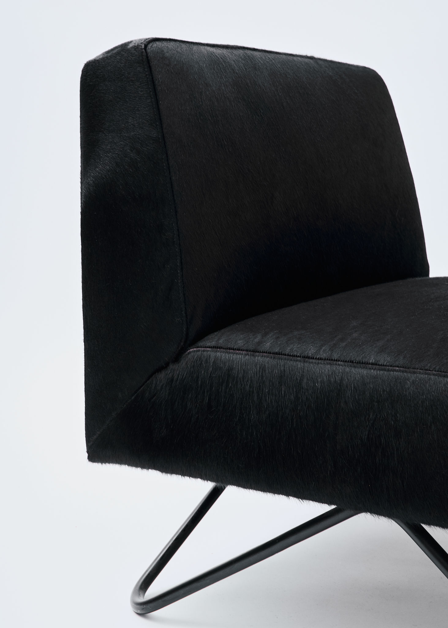 Woman walking on a curved pavement with shadow.