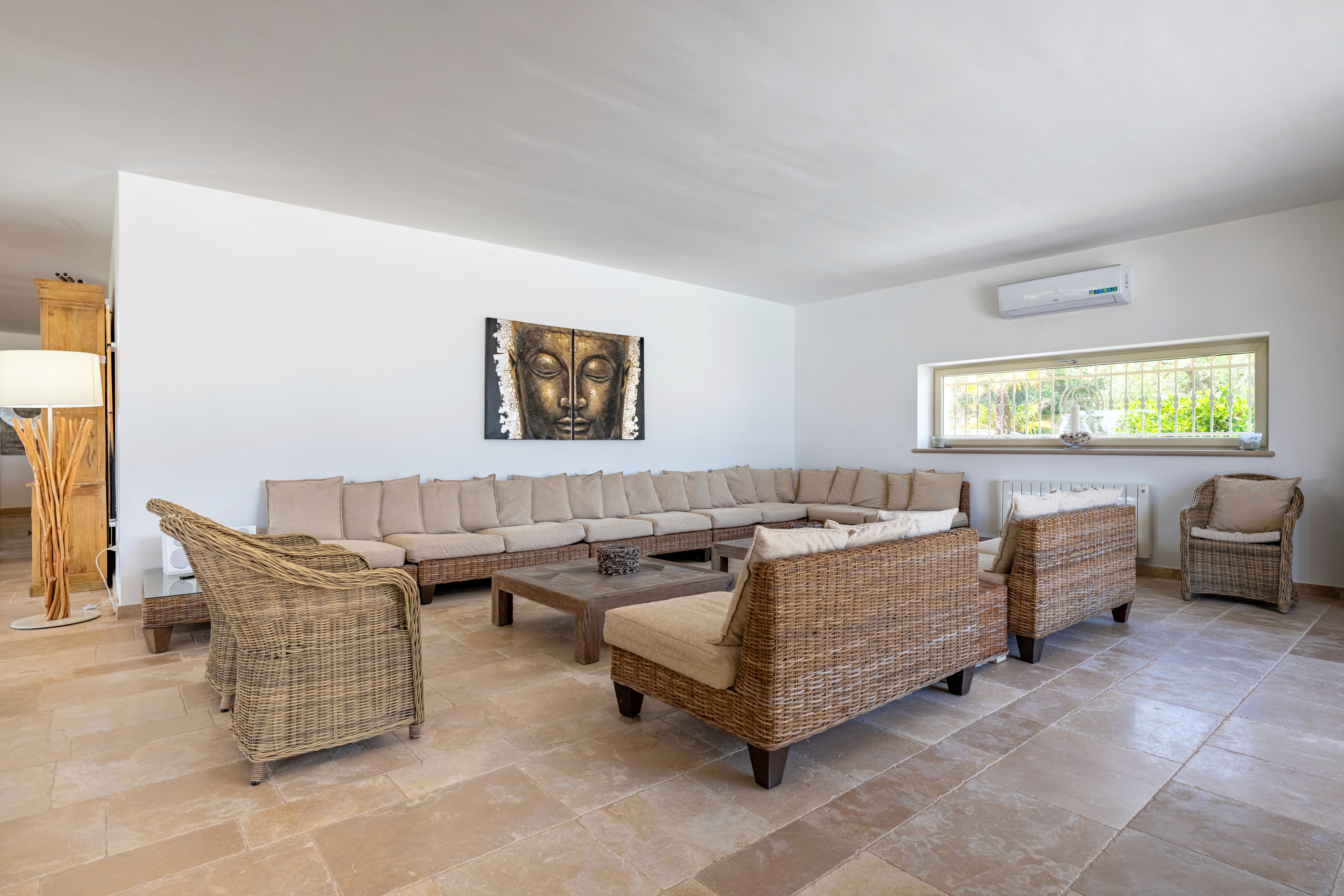 Bright bedroom with colorful bedspread and wall art