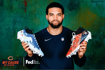 Quarterback Caleb Williams poses with two custom cleats.