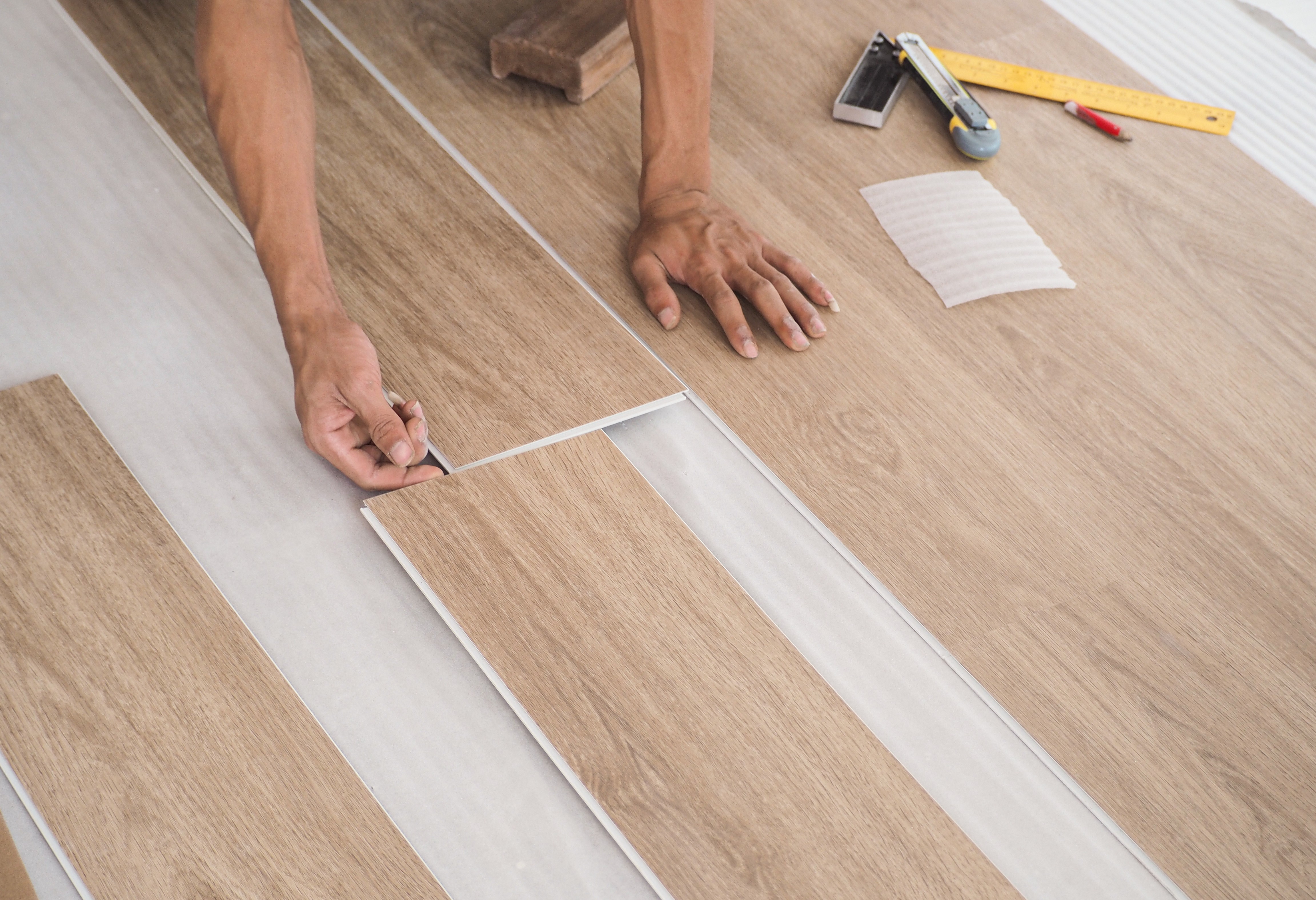 Laminate plank flooring being laid