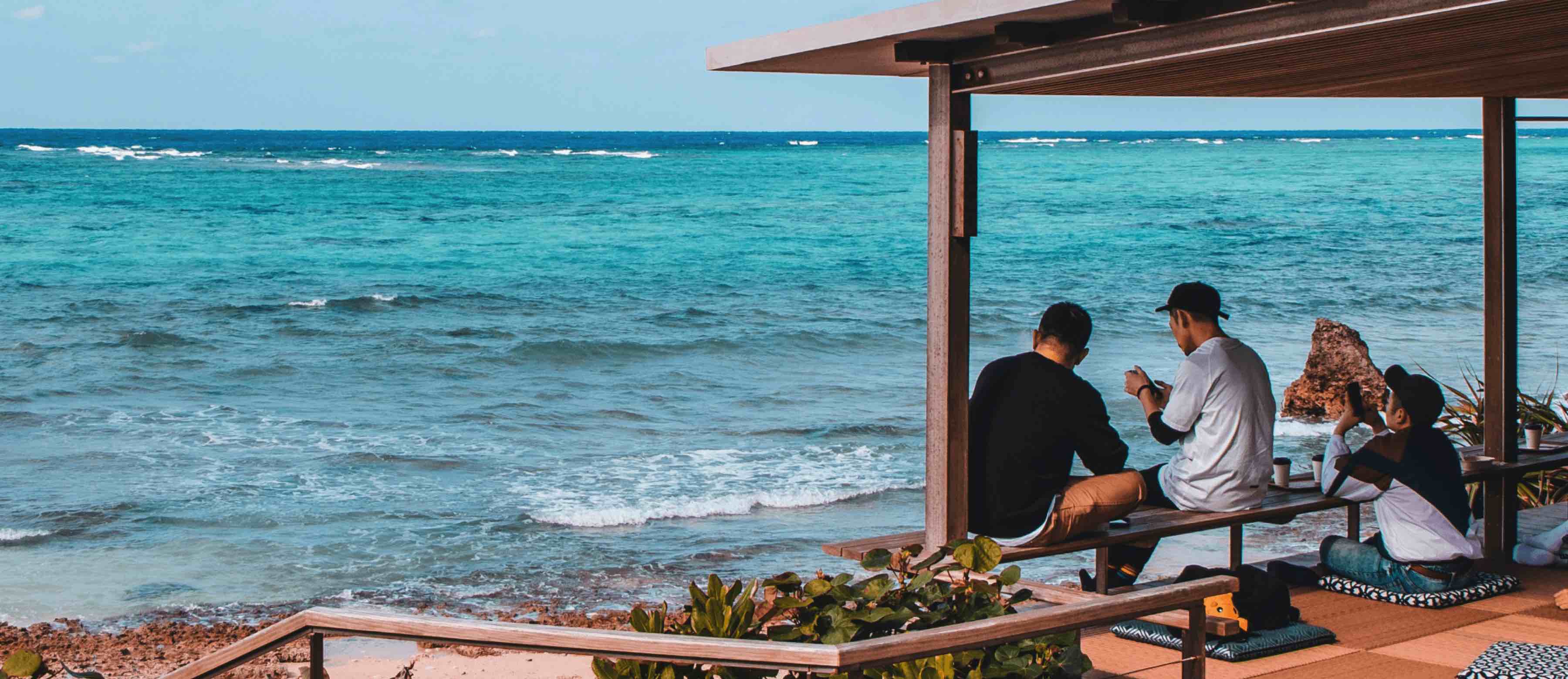 Travelers looking out at the ocean