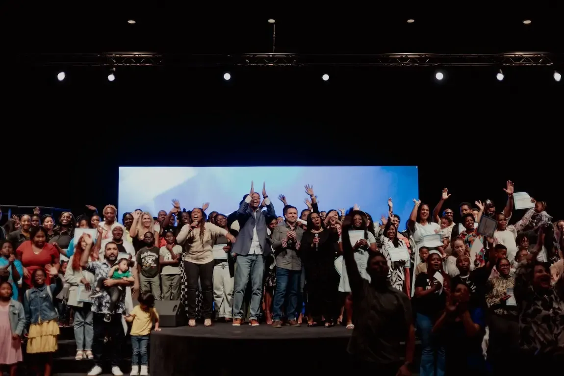 White building with red lighthouse under clear sky.