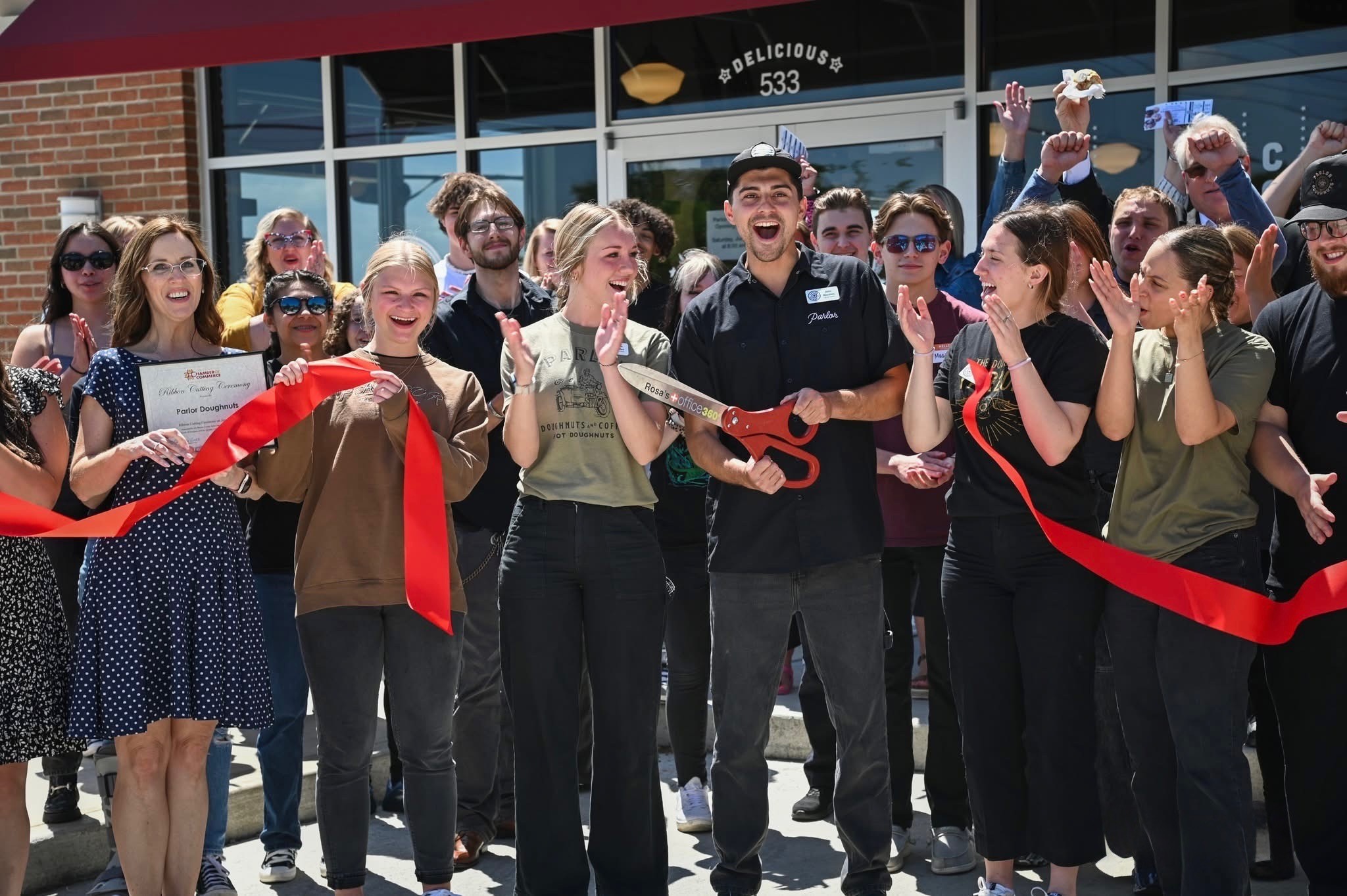 person pointing white paper on wall