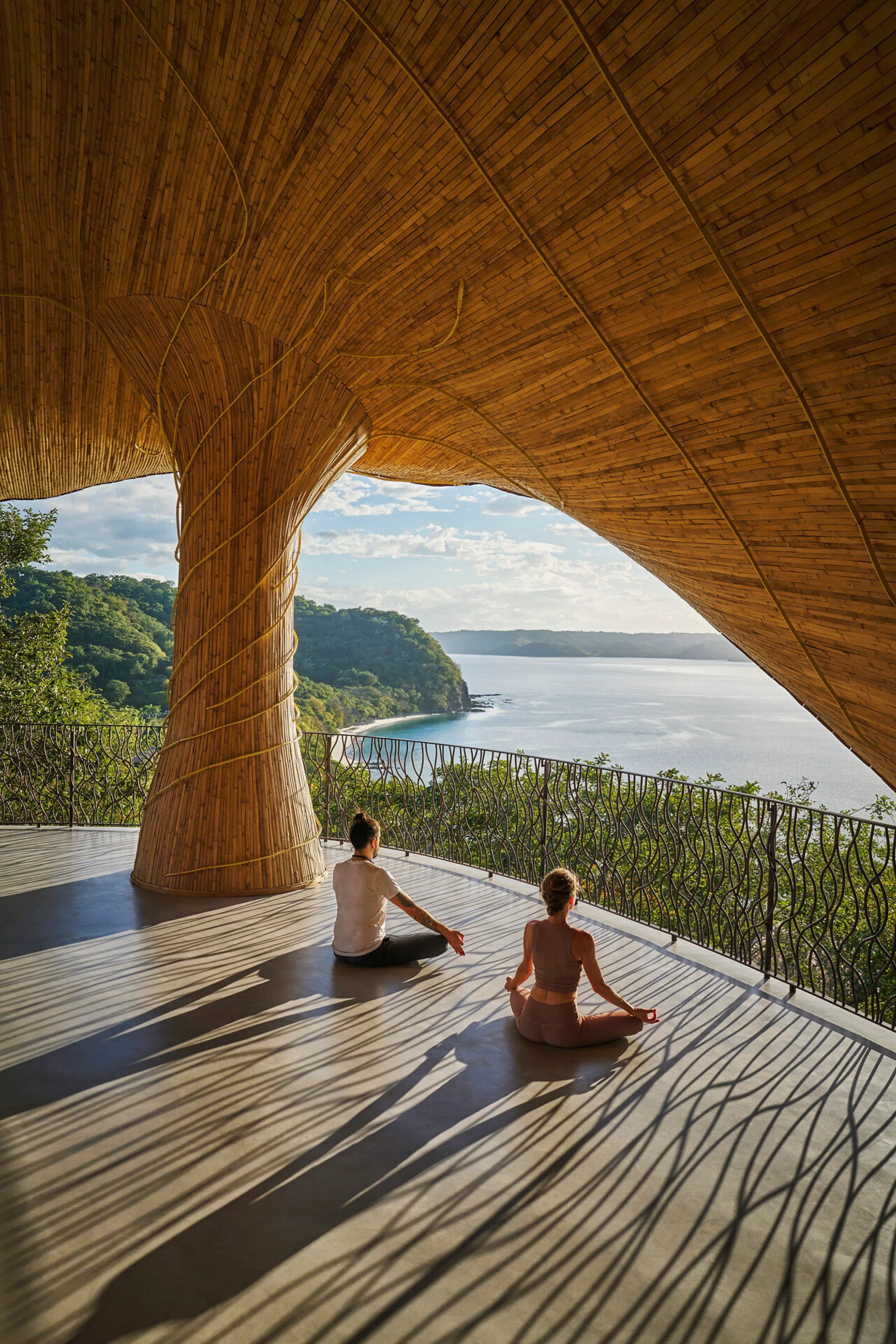 Close-up of the 12-meter-high bamboo catenary arches and intricate handcrafted weaving inspired by the Mexican Sea Slug (Cyphoma gibbosum).