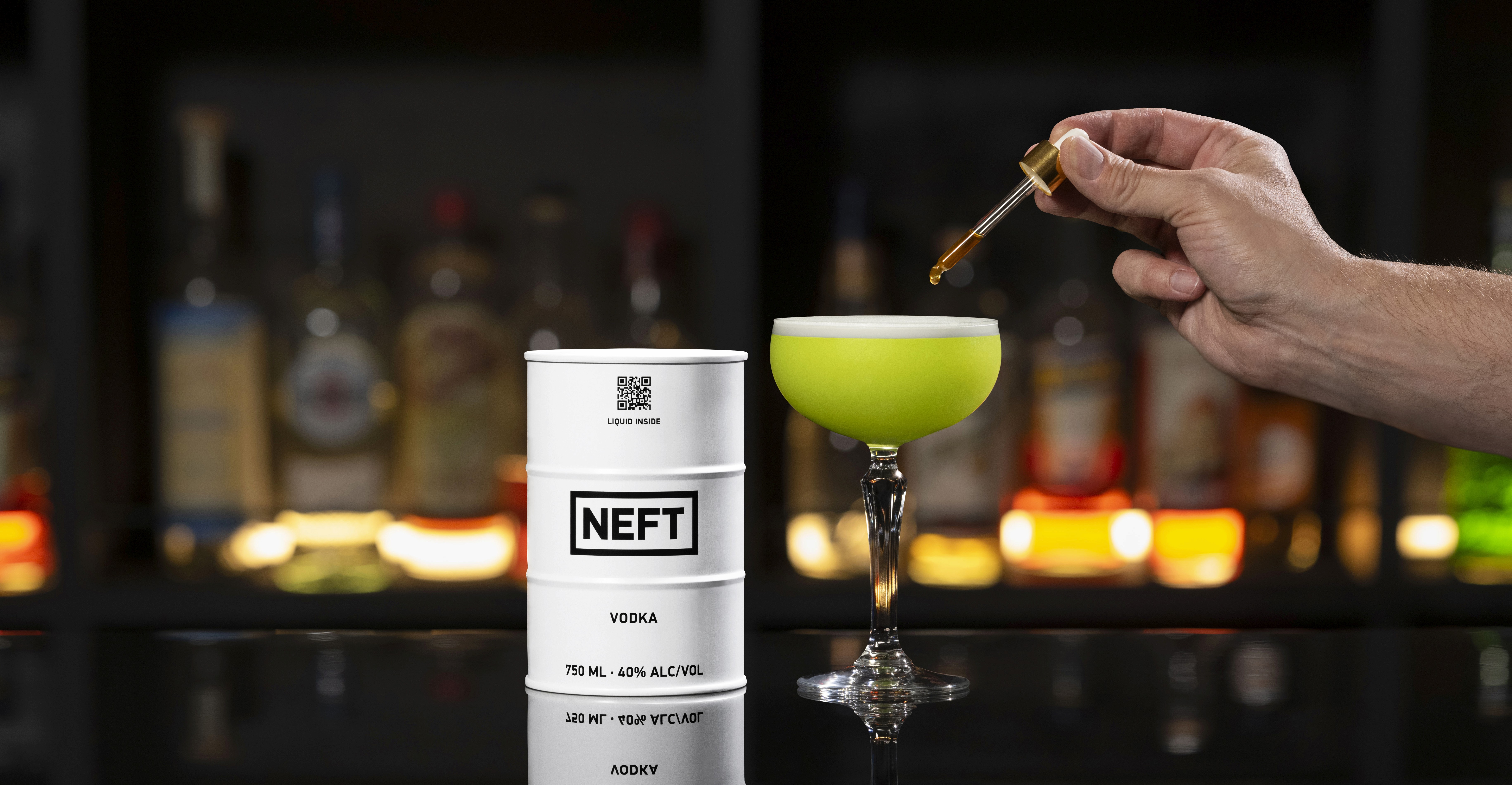 A NEFT Barrel and a glass of Irish Clover on a bar counter.