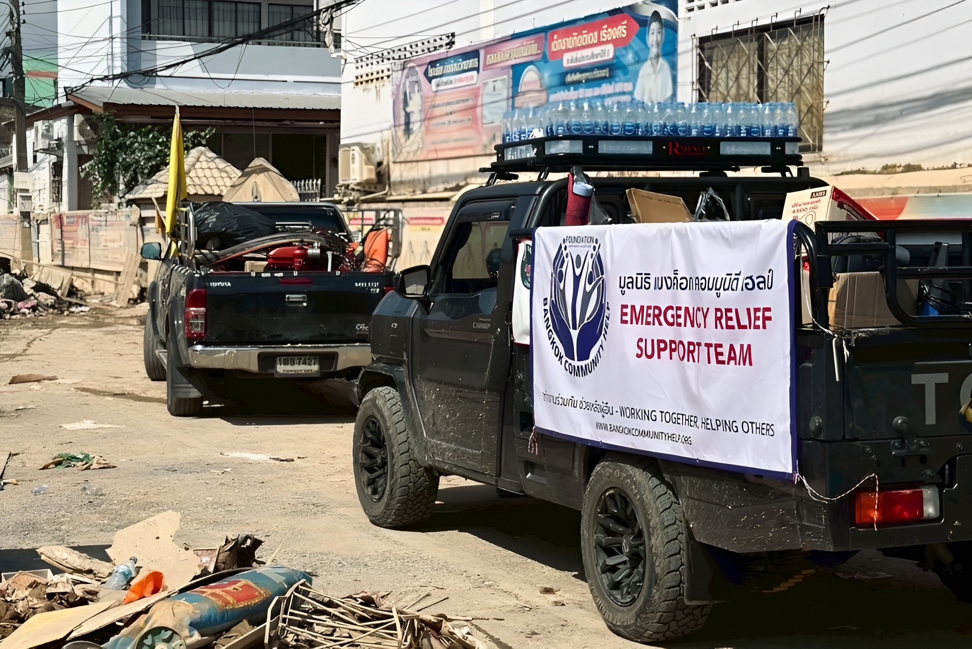 two young boys brushing their teeth in front of a crowd