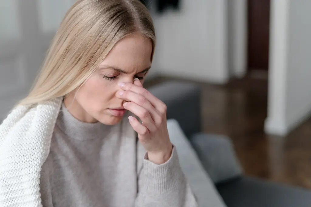 woman feeling nausea - Tirzepatide vs Semaglutide Side Effects 