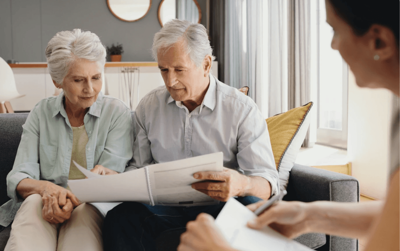 couple reviewing documents with advisor