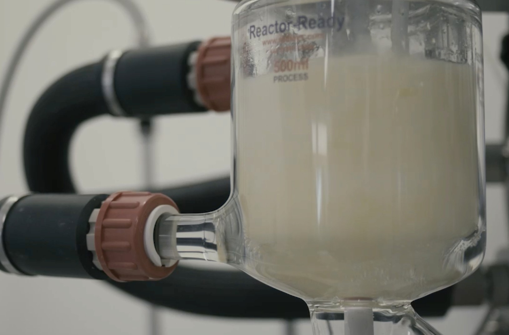 Reactor-Ready 500 ml jacketed glass process reactor filled with a pale liquid.