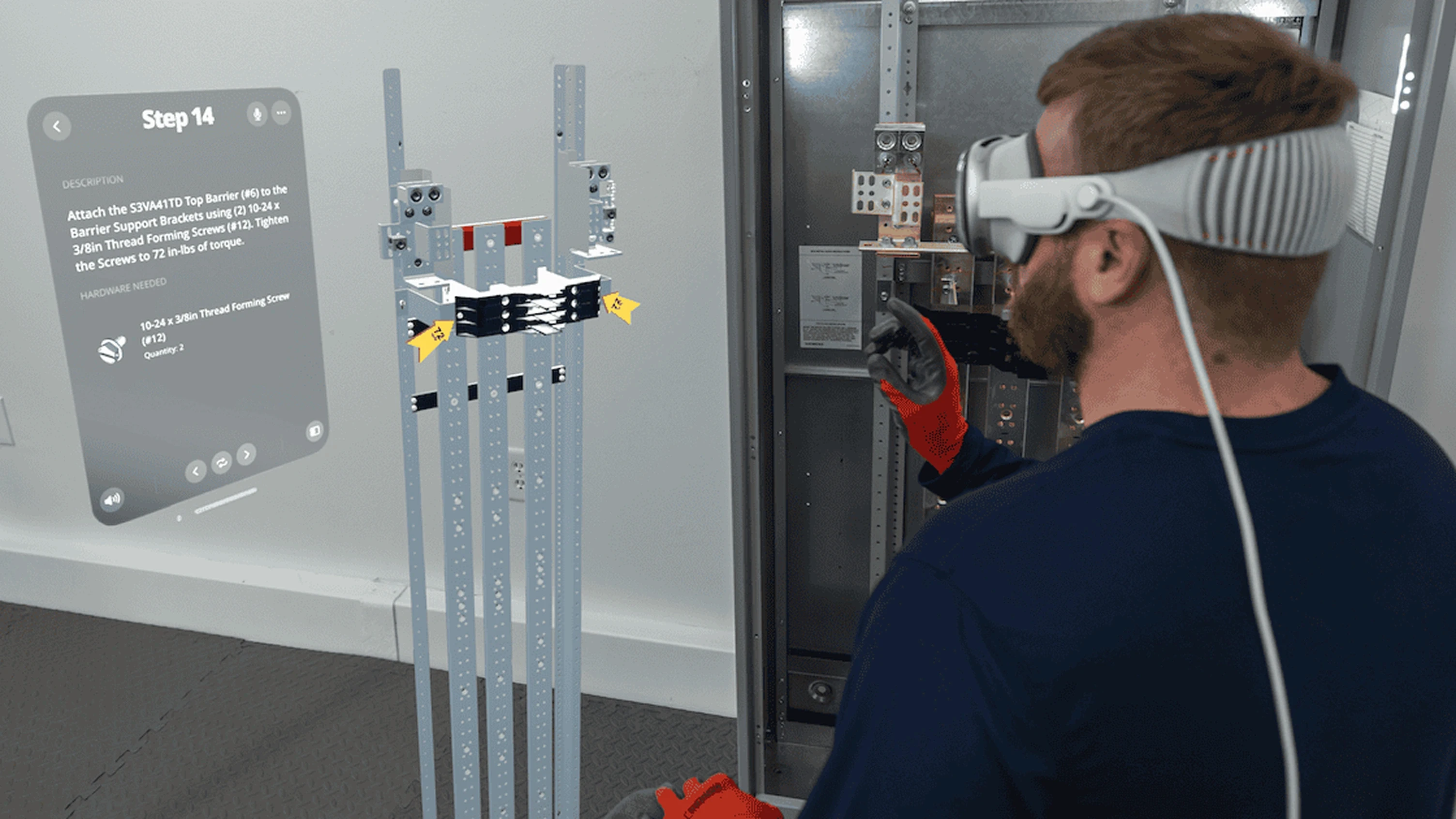 Worker wearing an Apple Vision Pro headset viewing step-by-step assembly instructions overlaid on an electrical panel