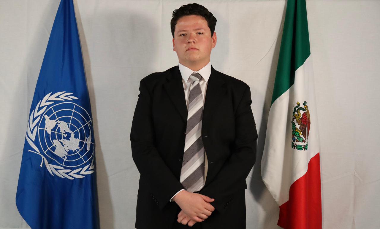 An orange cube-shaped side table is shown.