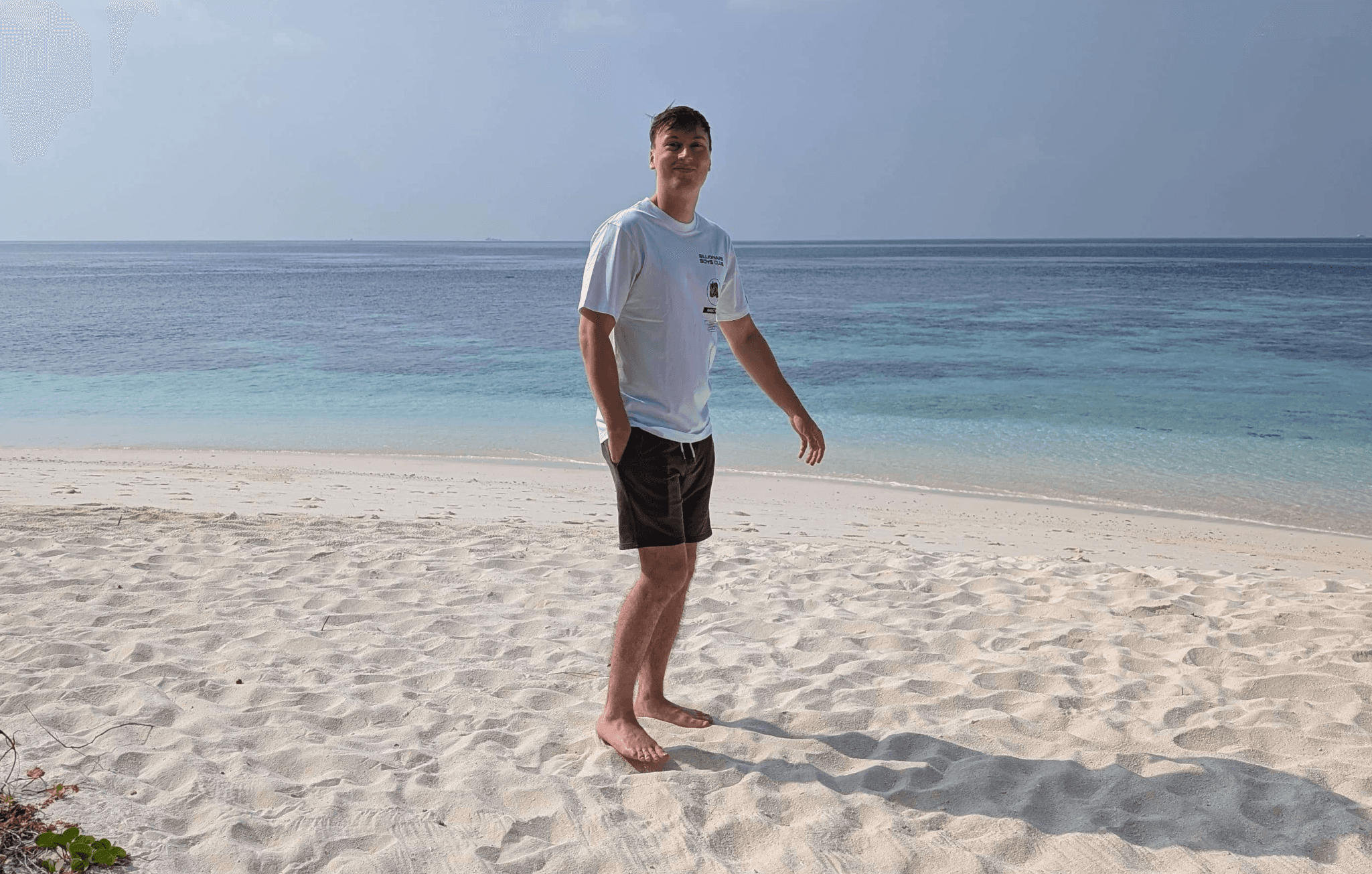 a blurry photo of a person standing in front of a wall