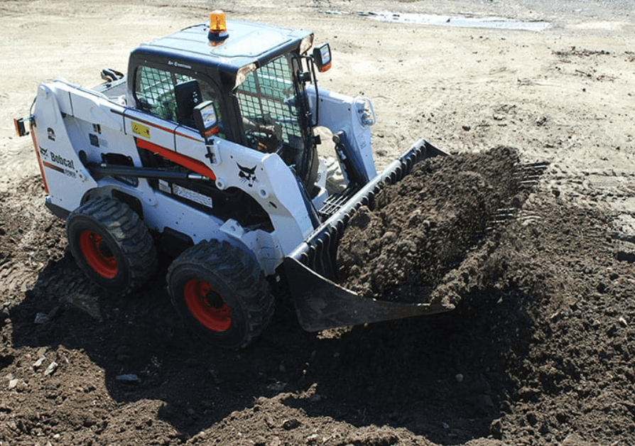 white tuck loading up dirt