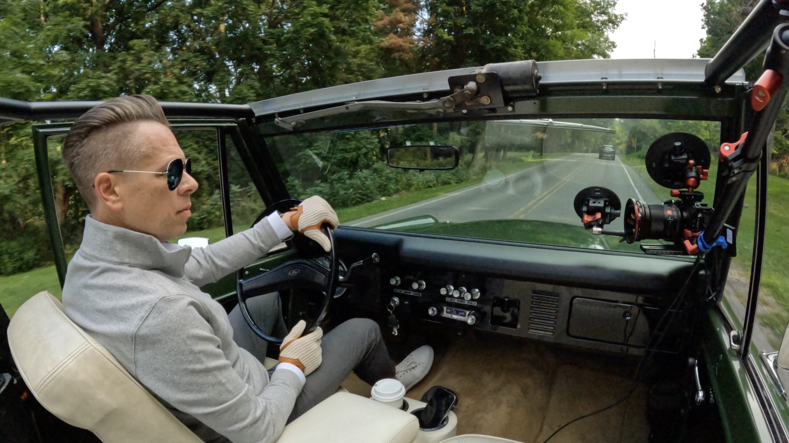 Christopher Norton driving a convertable car