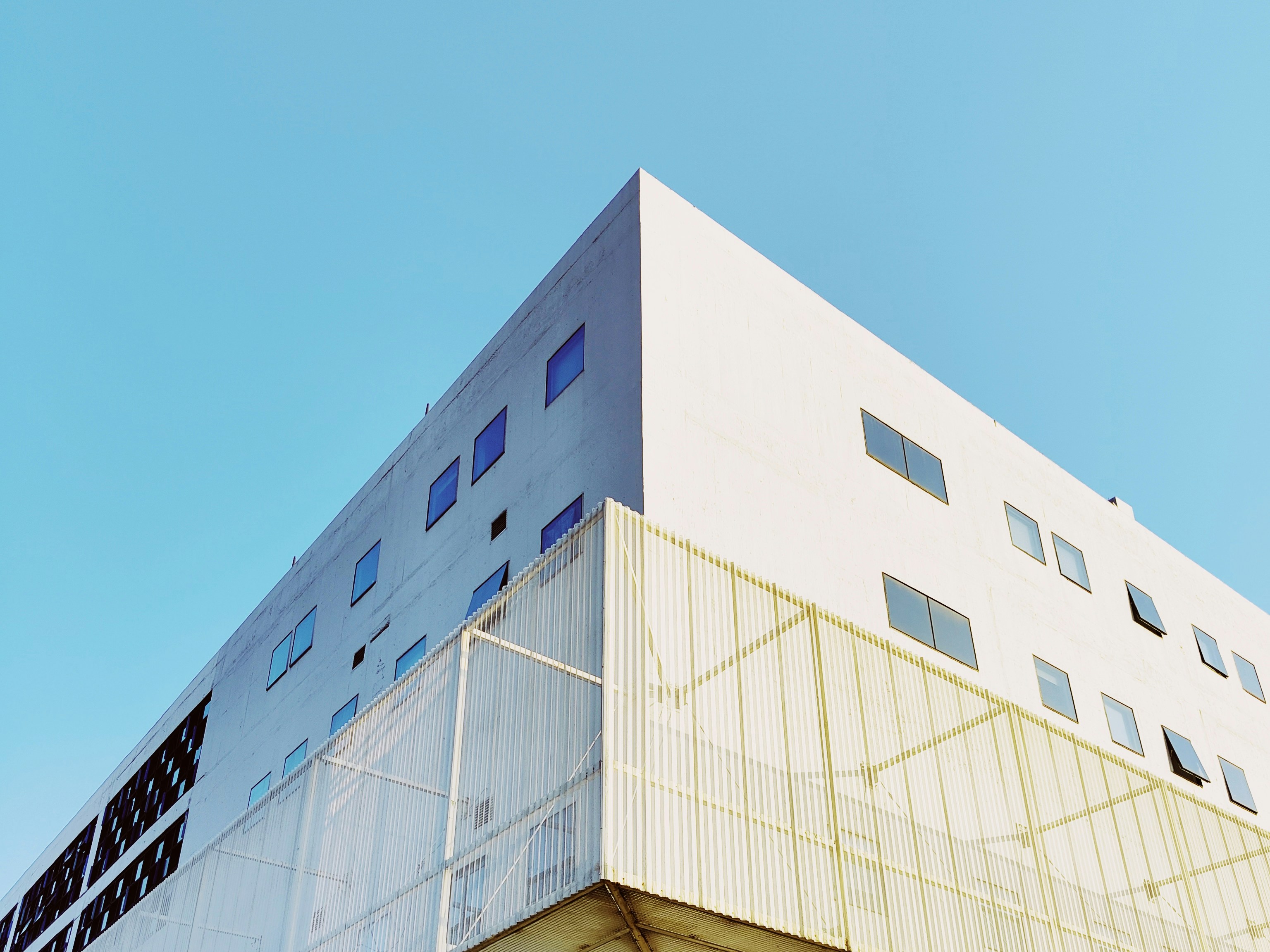 white concrete building under blue sky during daytime