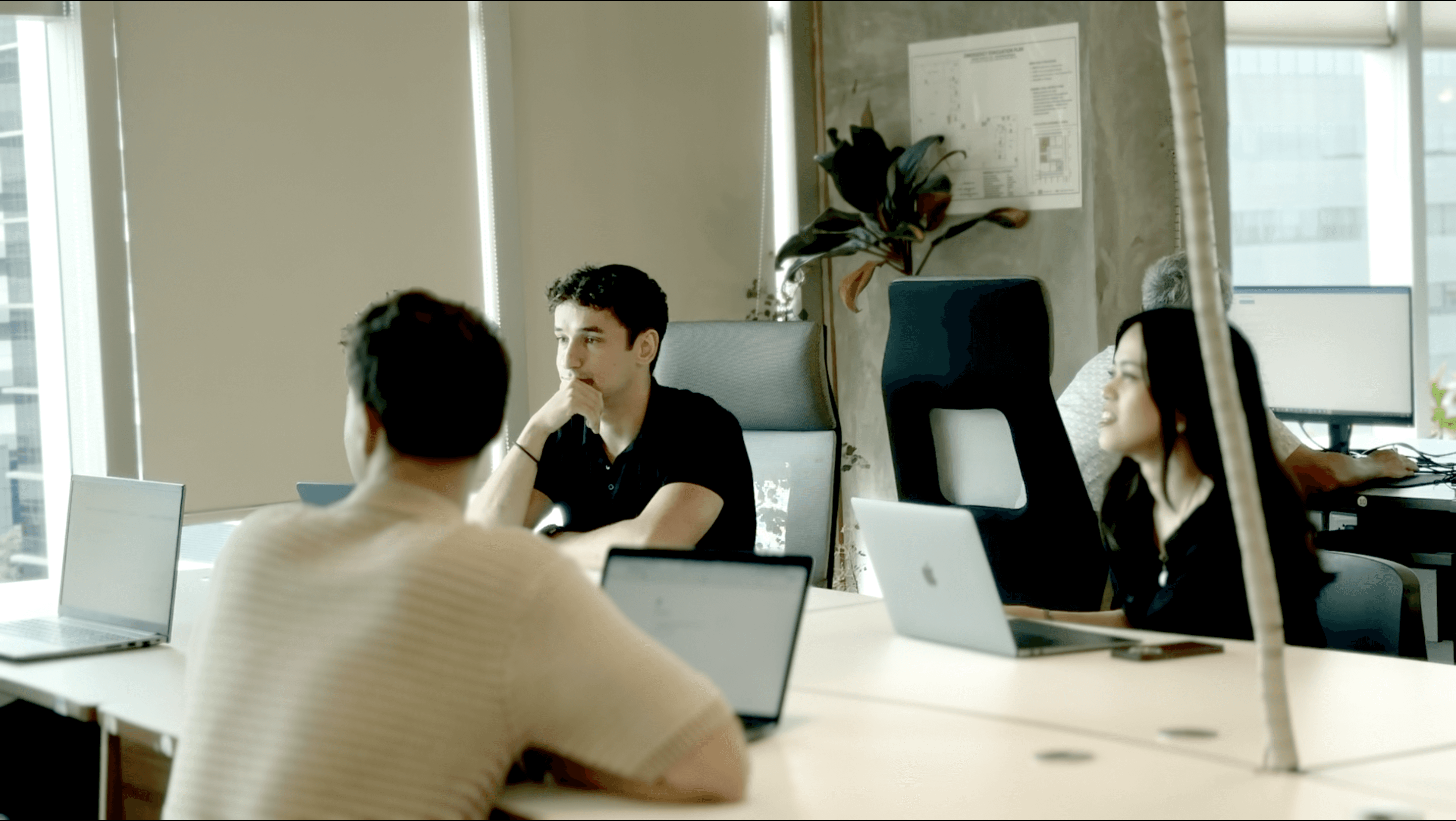 man standing near high-rise building