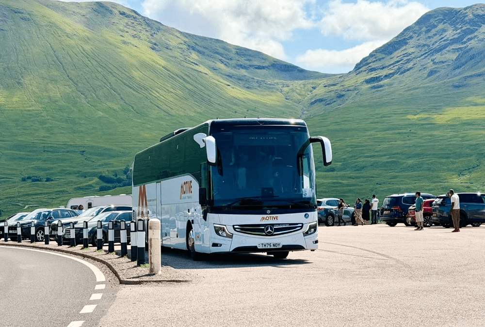 Luxury coach and minibus fleet used for city tours and private transfers, showcasing premium travel services and modern design in urban and scenic environments