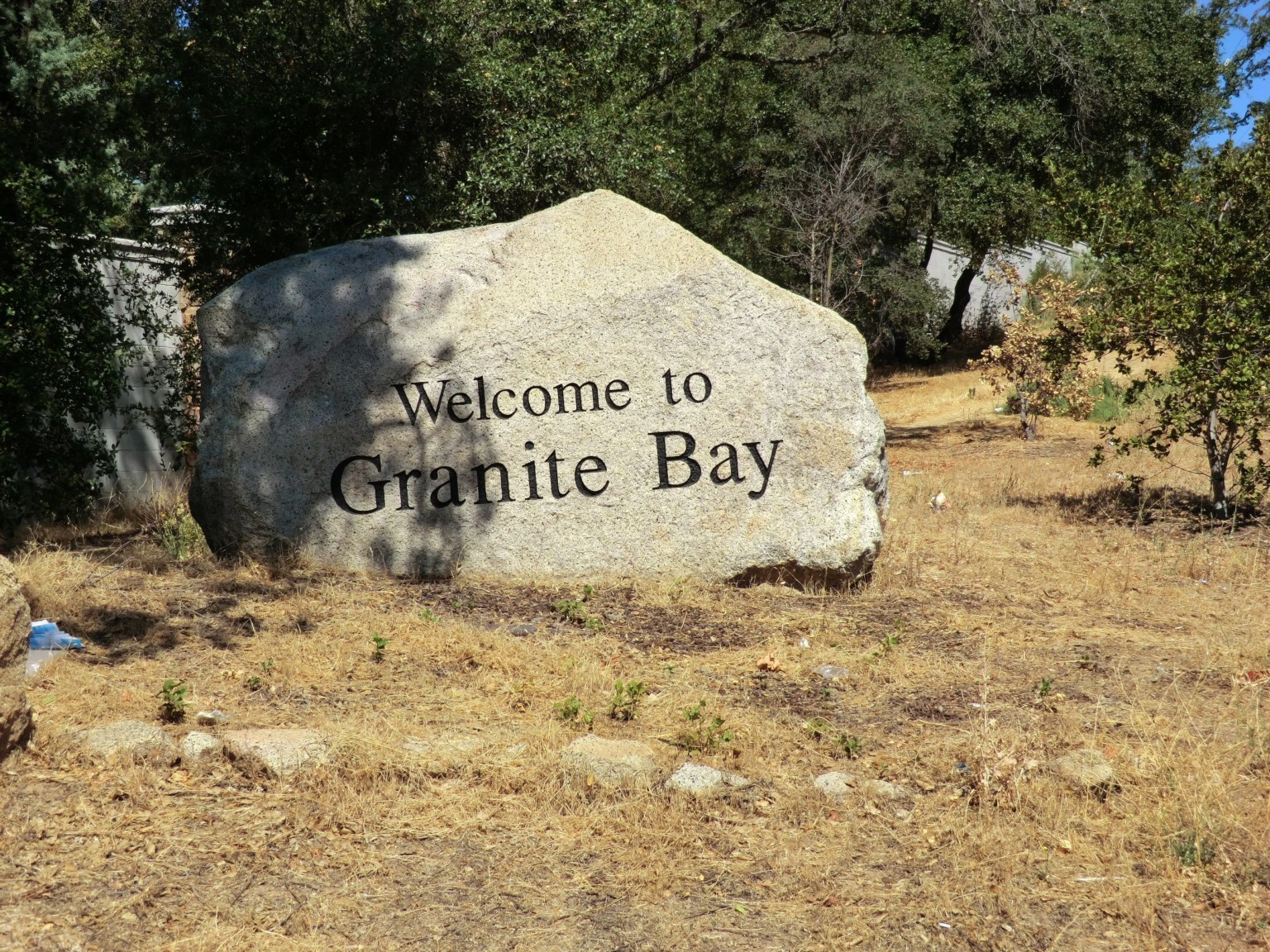 "Welcome to Granite Bay" chiselled upon a large granite rock.