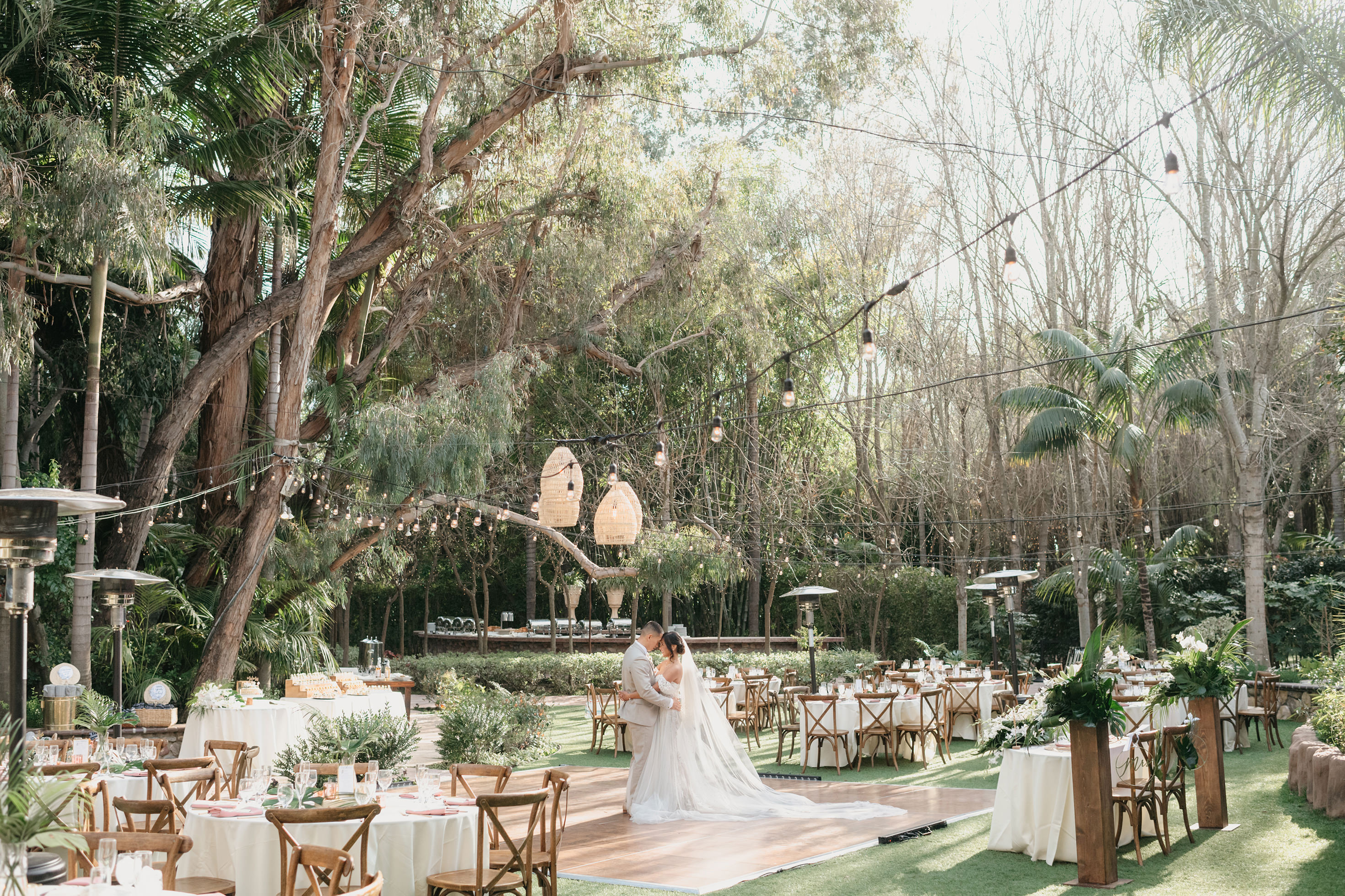 Outdoor wedding reception tablescape under the trees