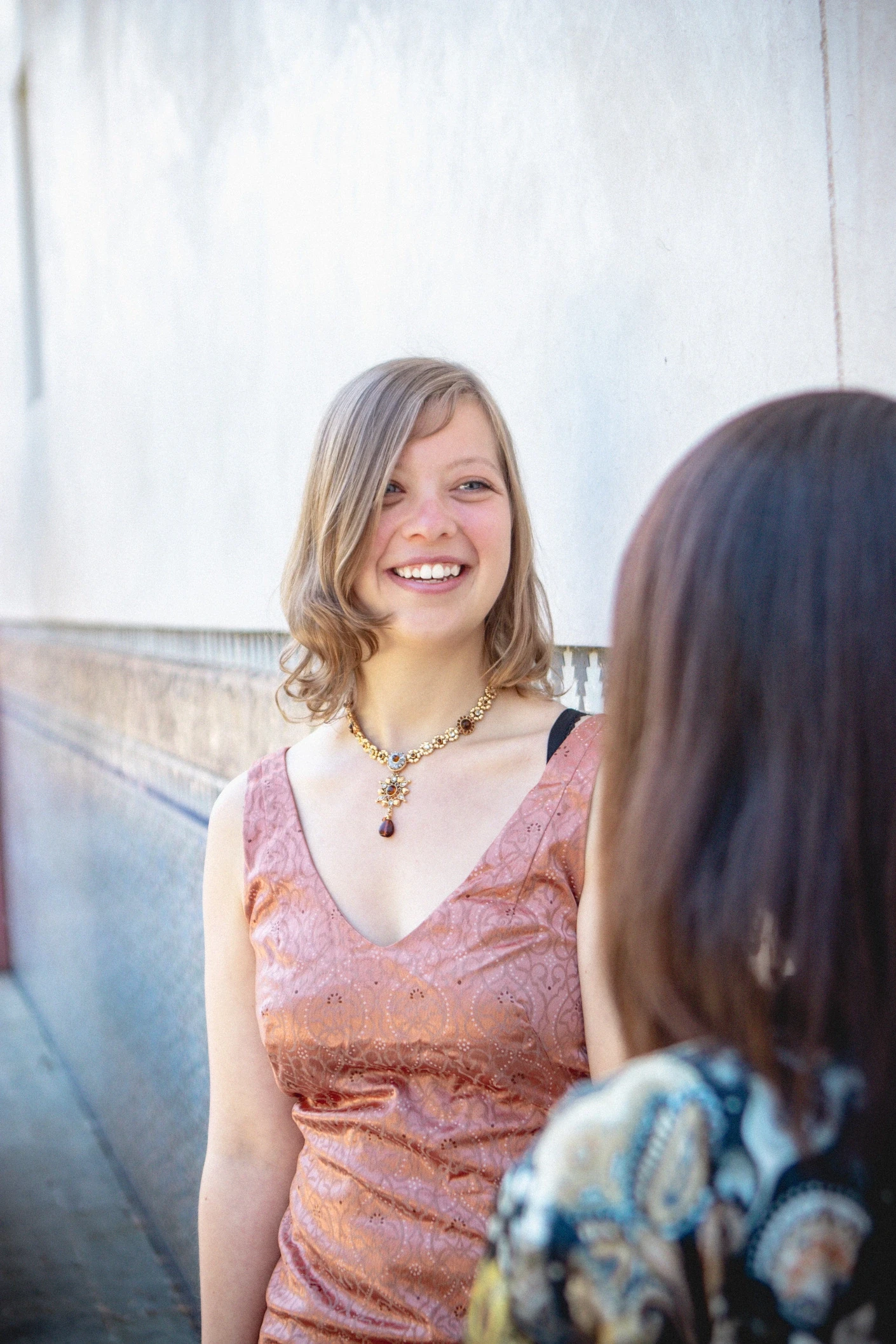 Woman looking happy and positive while talking with someone.