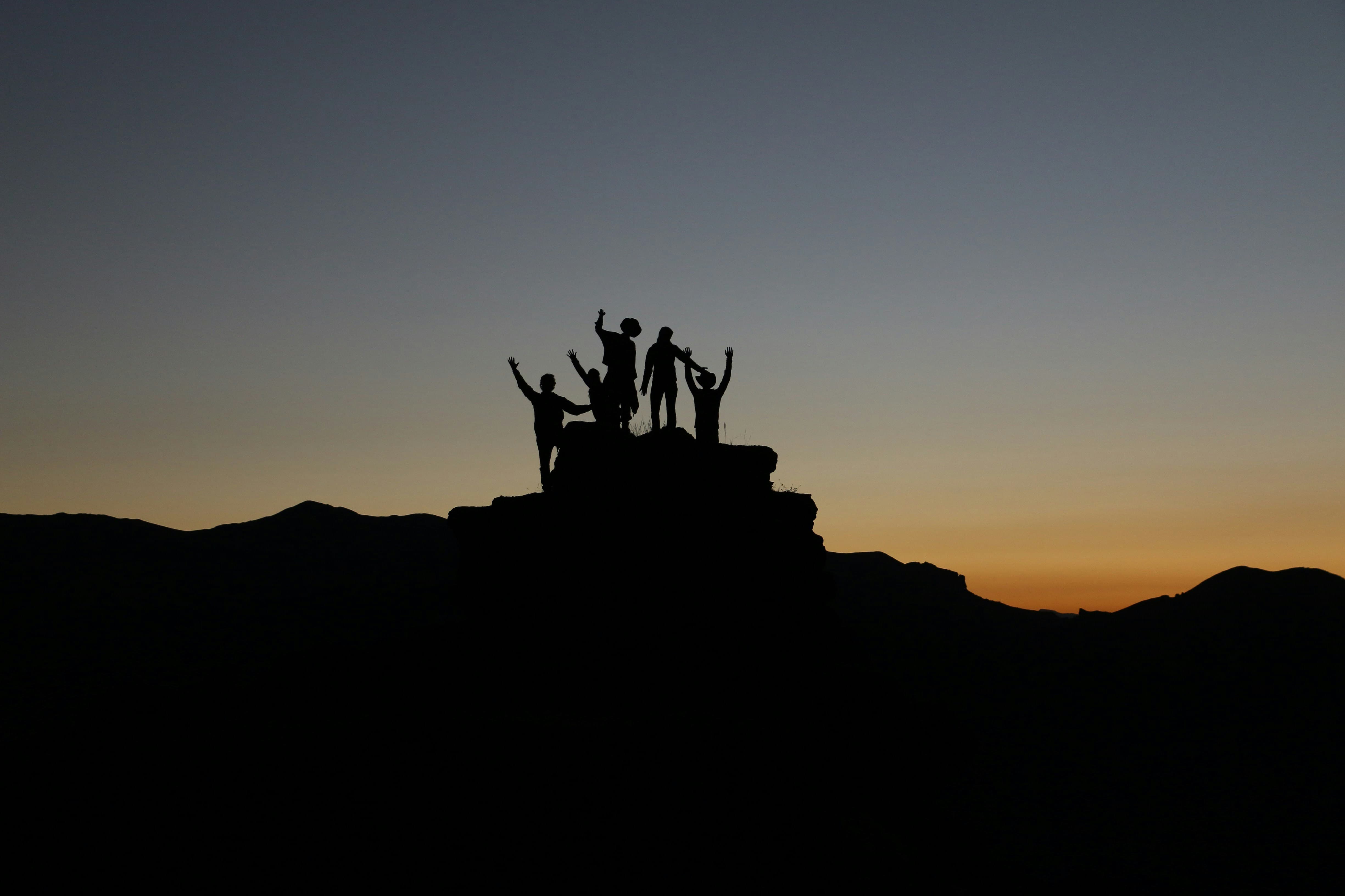 Silhouette of people at sunset
