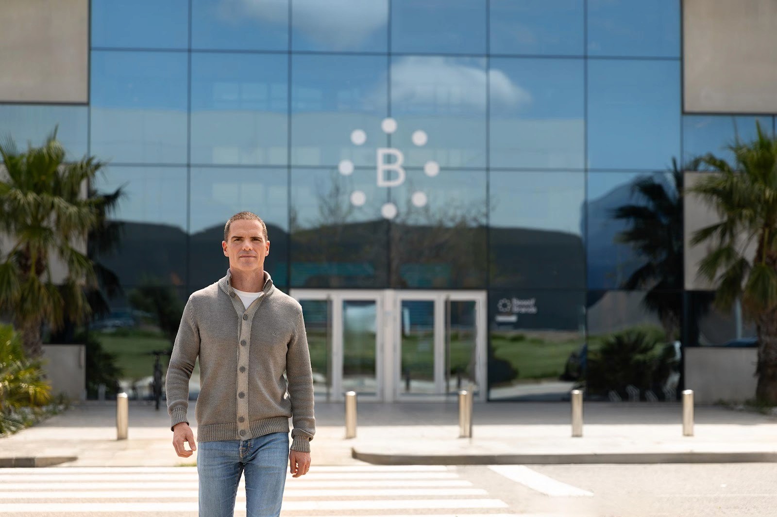 Founder of Beself Brands is walking near the the main office building