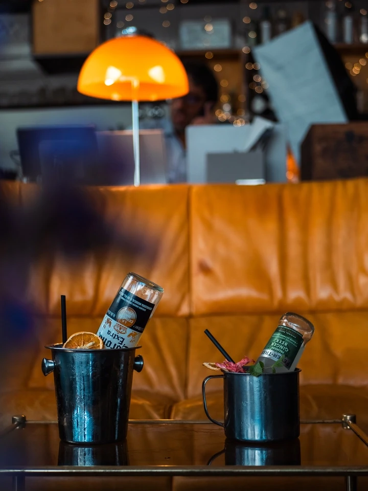 Portrait of a woman standing at a bar
