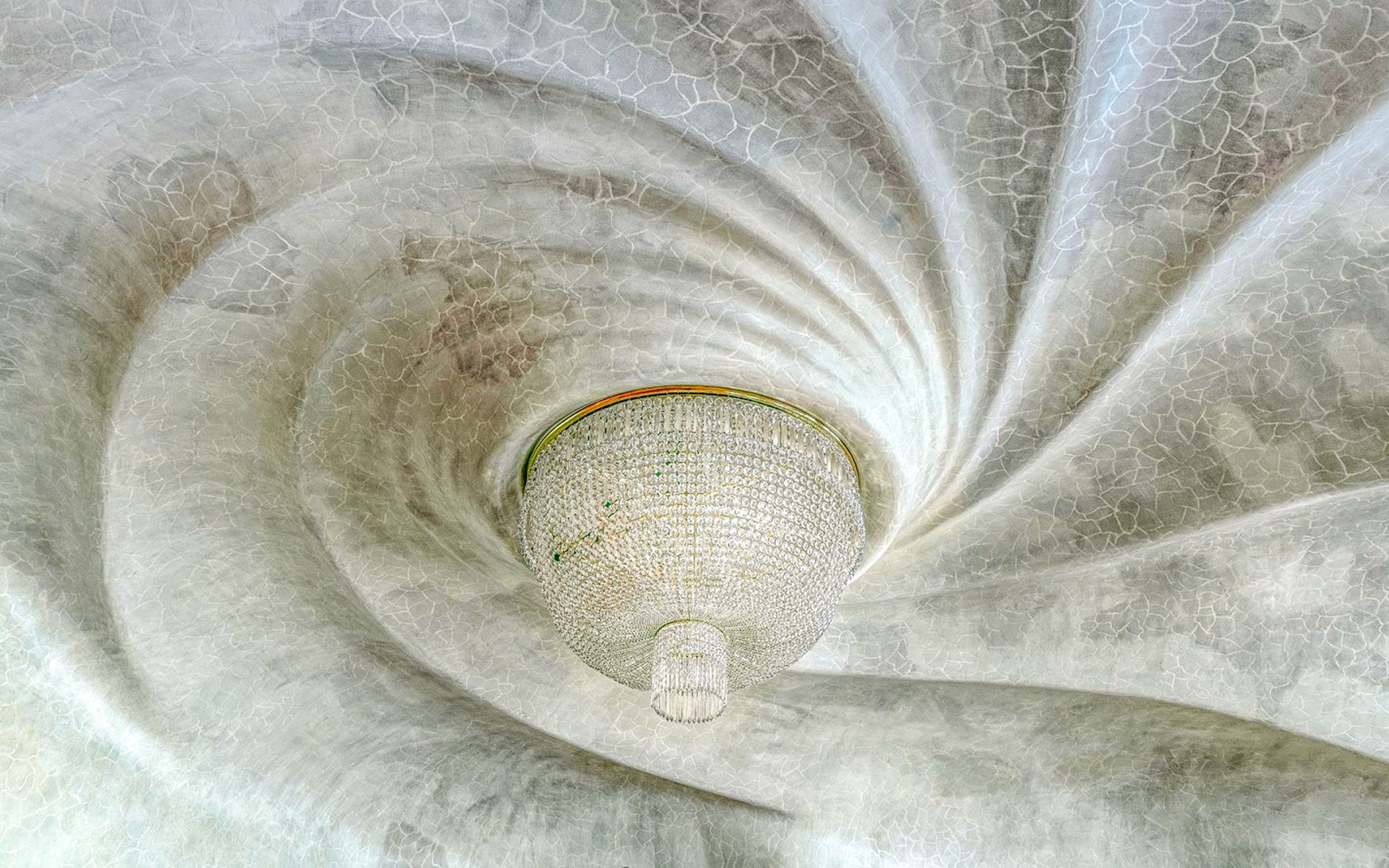 Casa Batlló ceiling with ornate chandelier, Barcelona.