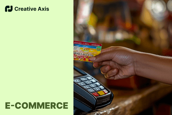 Hand tapping a credit card on a POS terminal for E-commerce transaction.