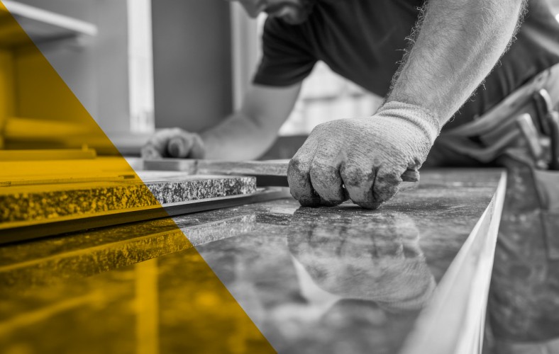 Construction worker operating industrial equipment, representing AI-powered project management and workflow automation