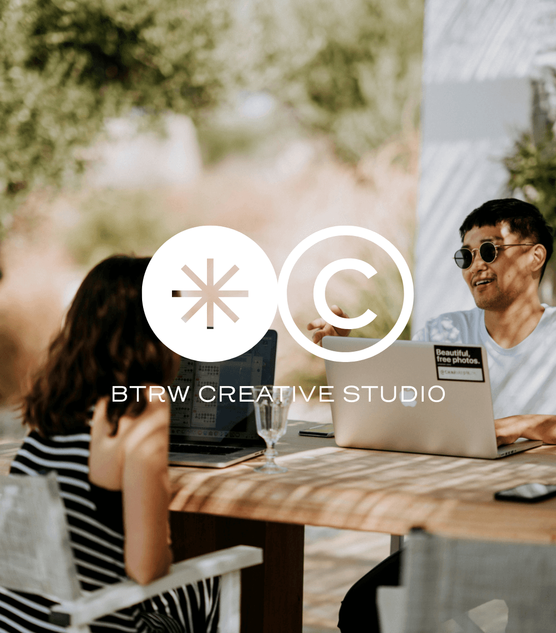 Free Framer Template - A cozy interior of a cafe with wooden tables, chairs, and potted plants, creating a warm atmosphere.