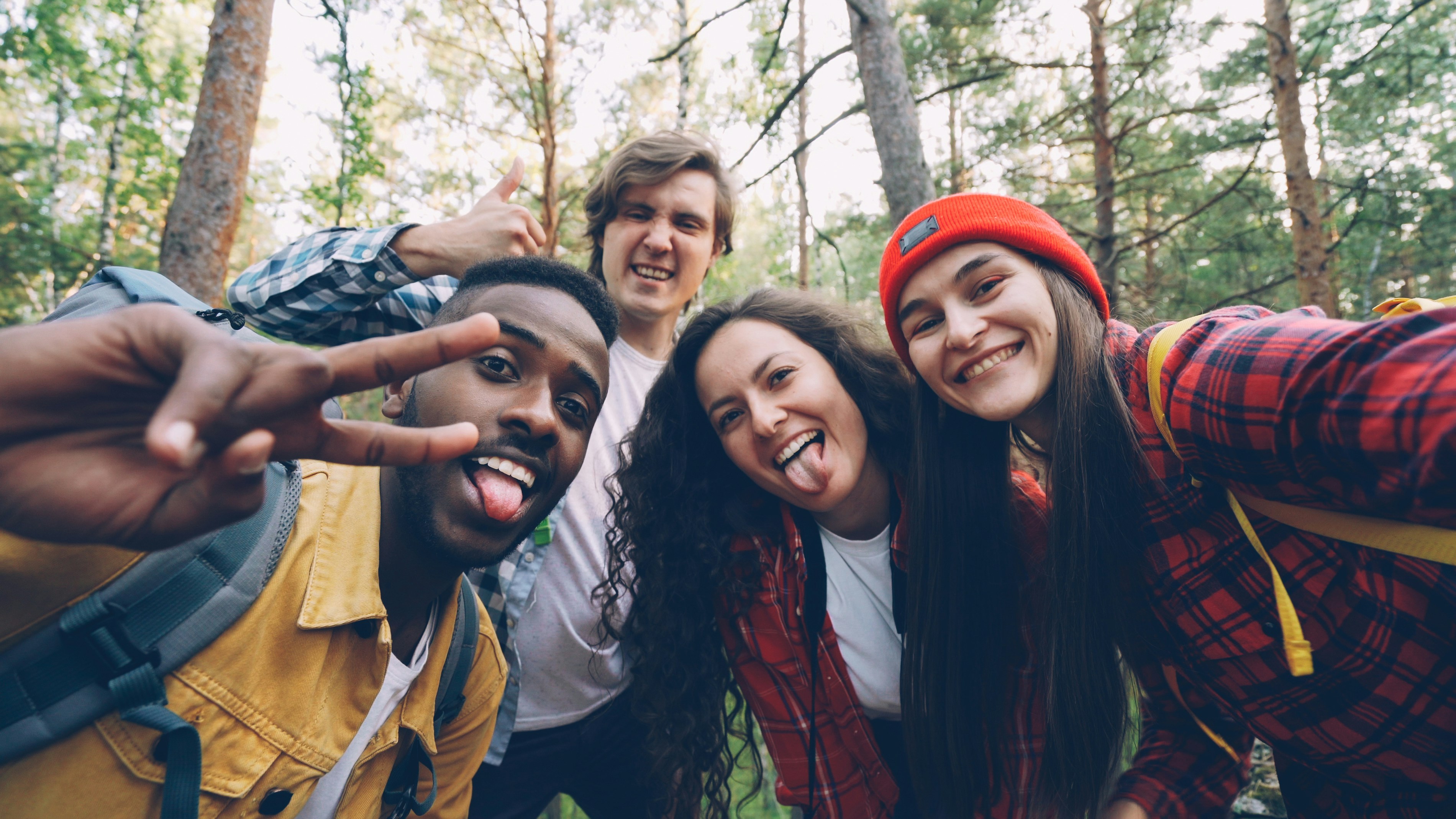 Friends taking a selfie in a forest