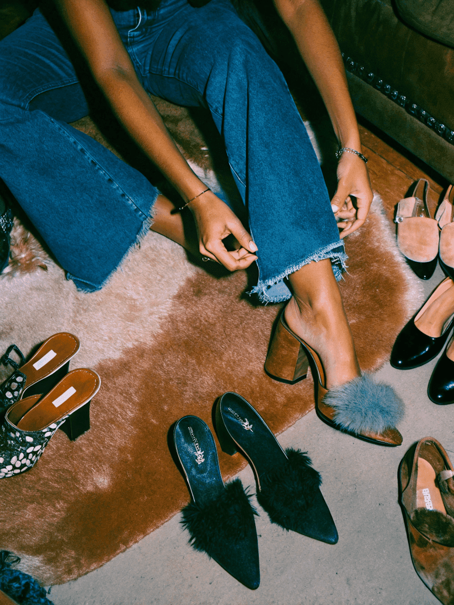 a person sitting on a couch with a laptop