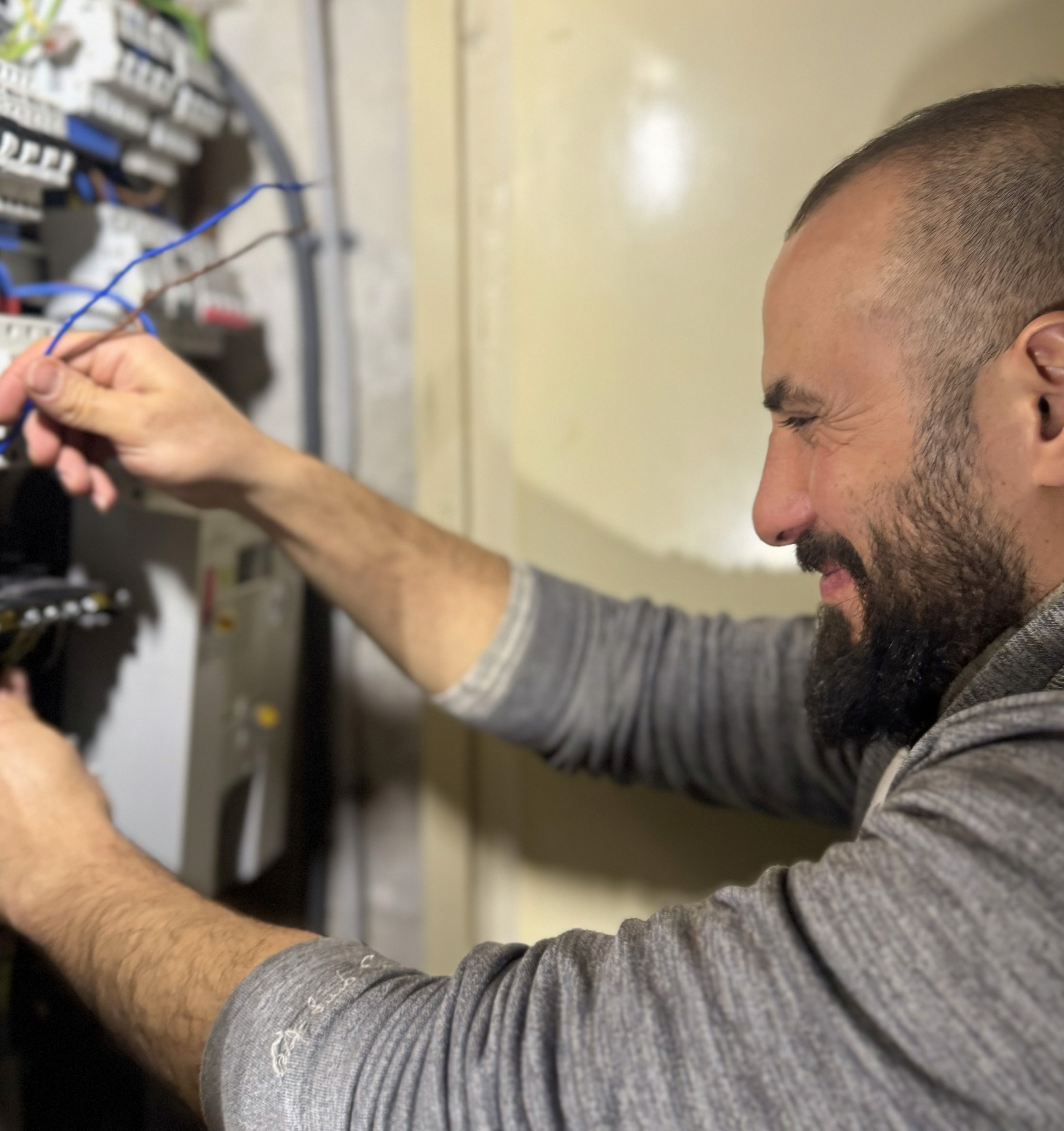 Electrician looking at cables