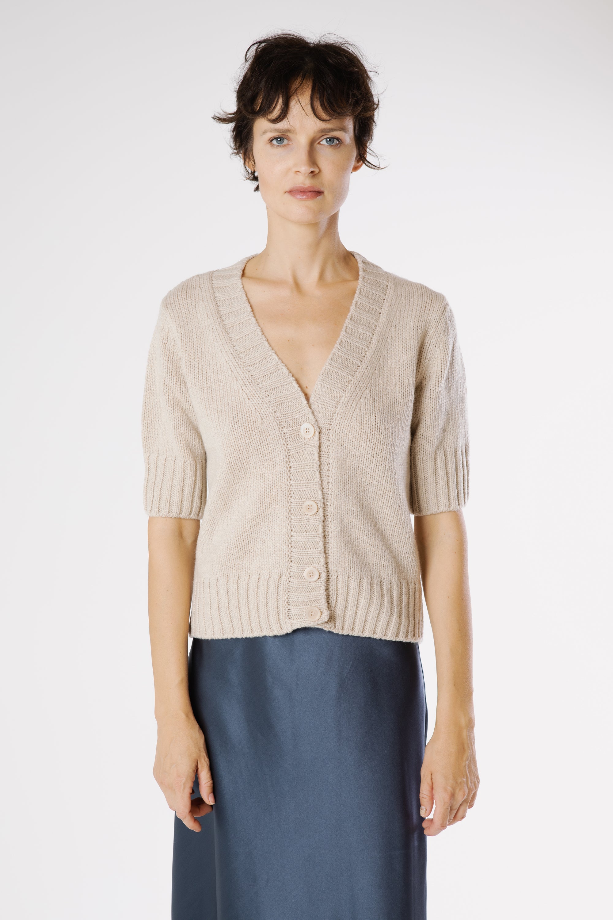 Front view of Artemisa Cashmere Cardigan Sphinx in warm beige Italian cashmere with V-neckline and ribbed detailing.