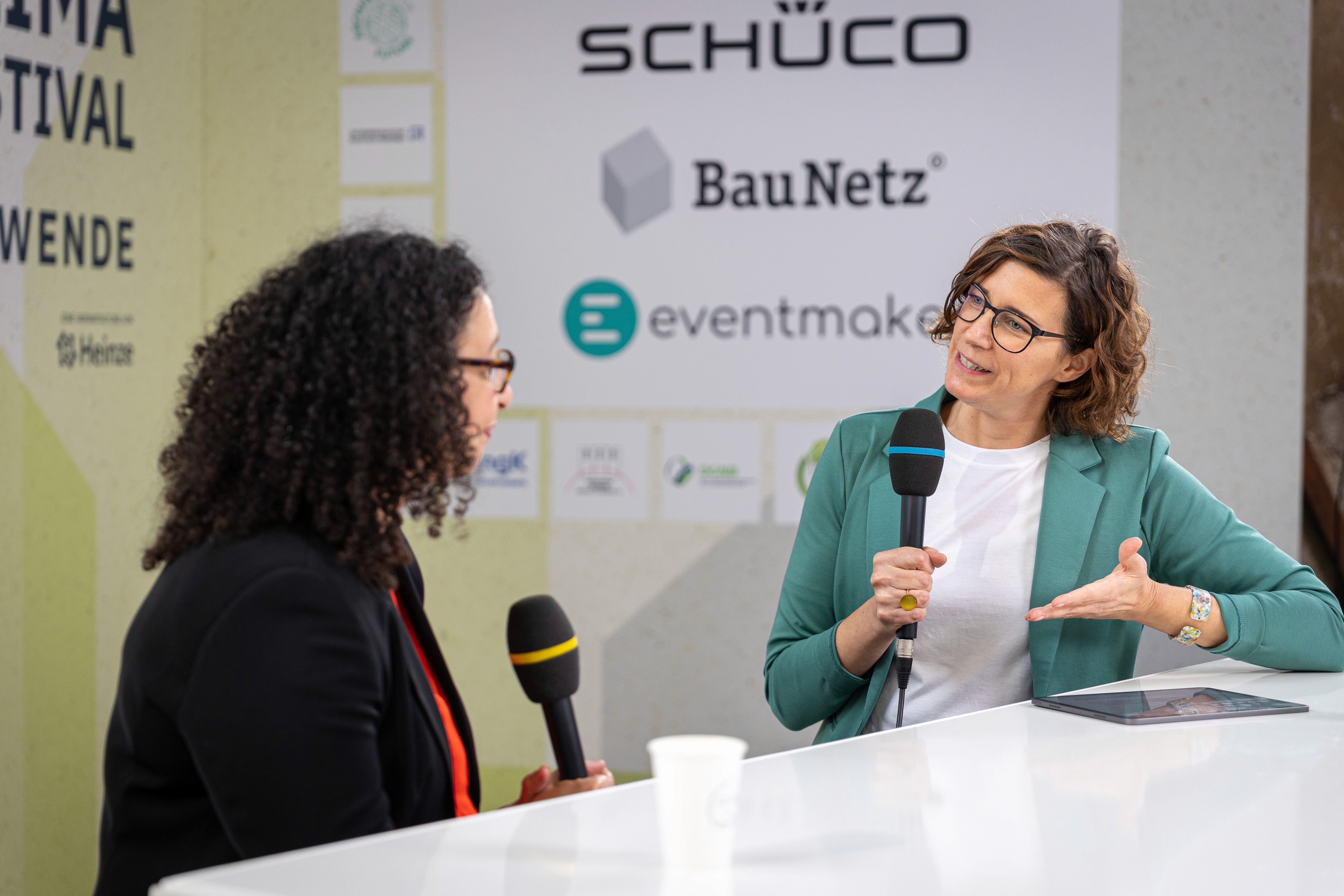 people sitting on chair in front of laptop computers