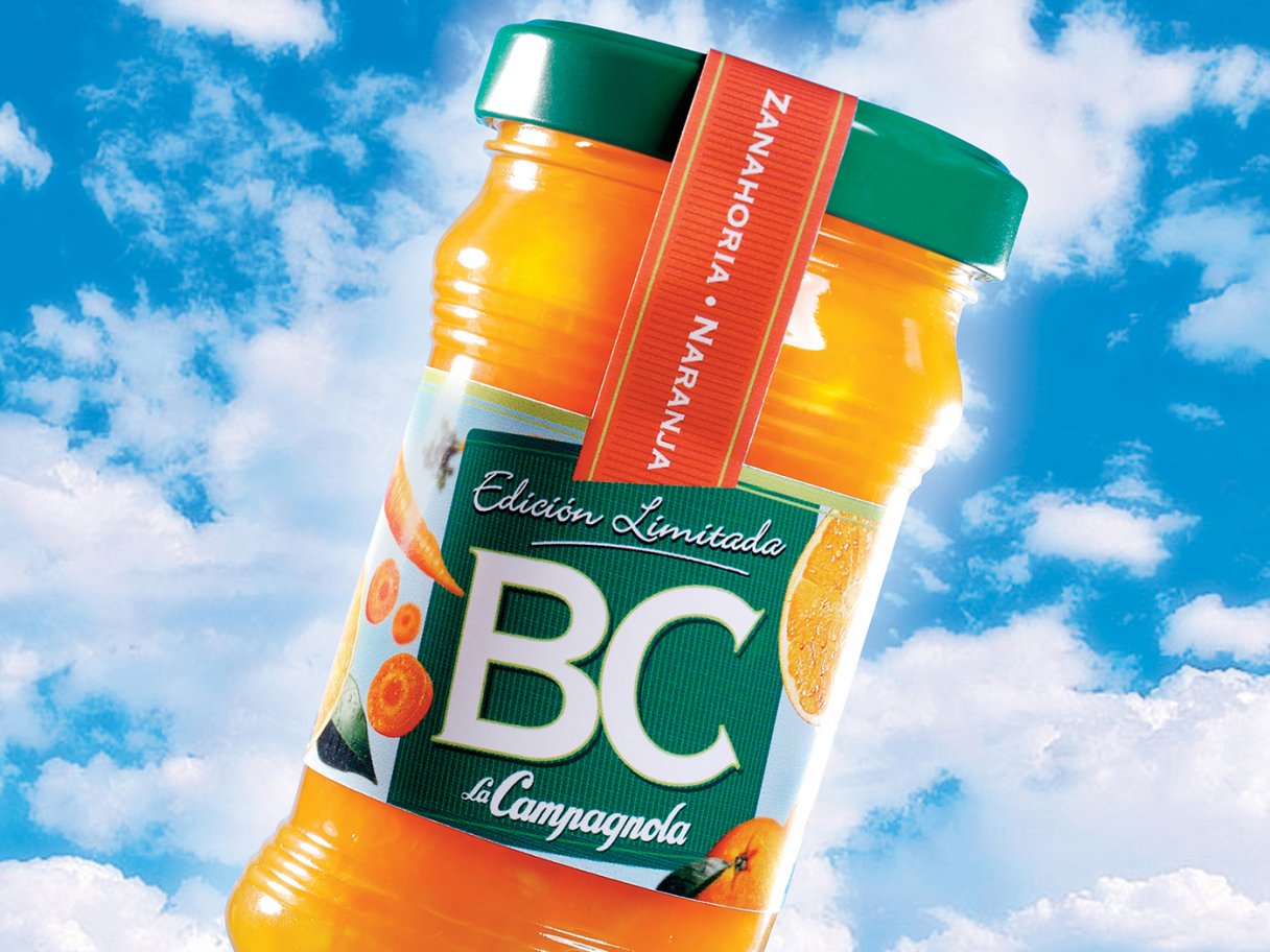 Rustic cabin in a golden field at sunset