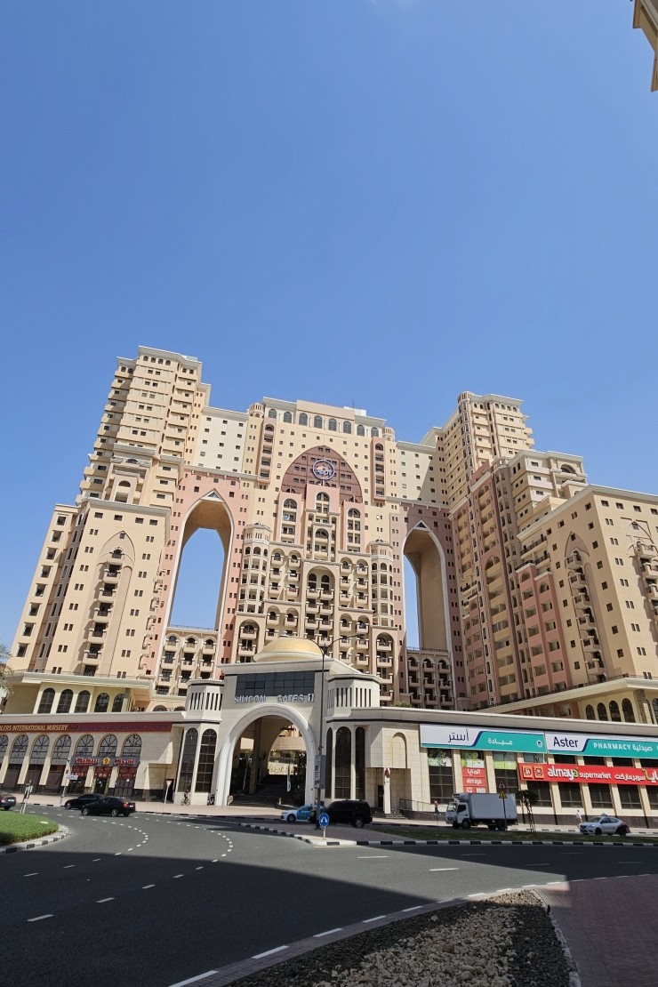 Grand arched entrance of Silicon Gates 1, your professional gateway to luxury real estate in Dubai.