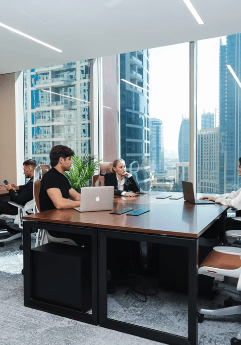 Modern serviced offices conference room with marble tables, leather chairs, and LED lights.