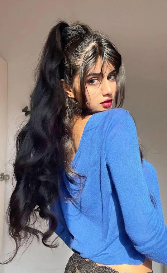 husband and wife working happily on a laptop