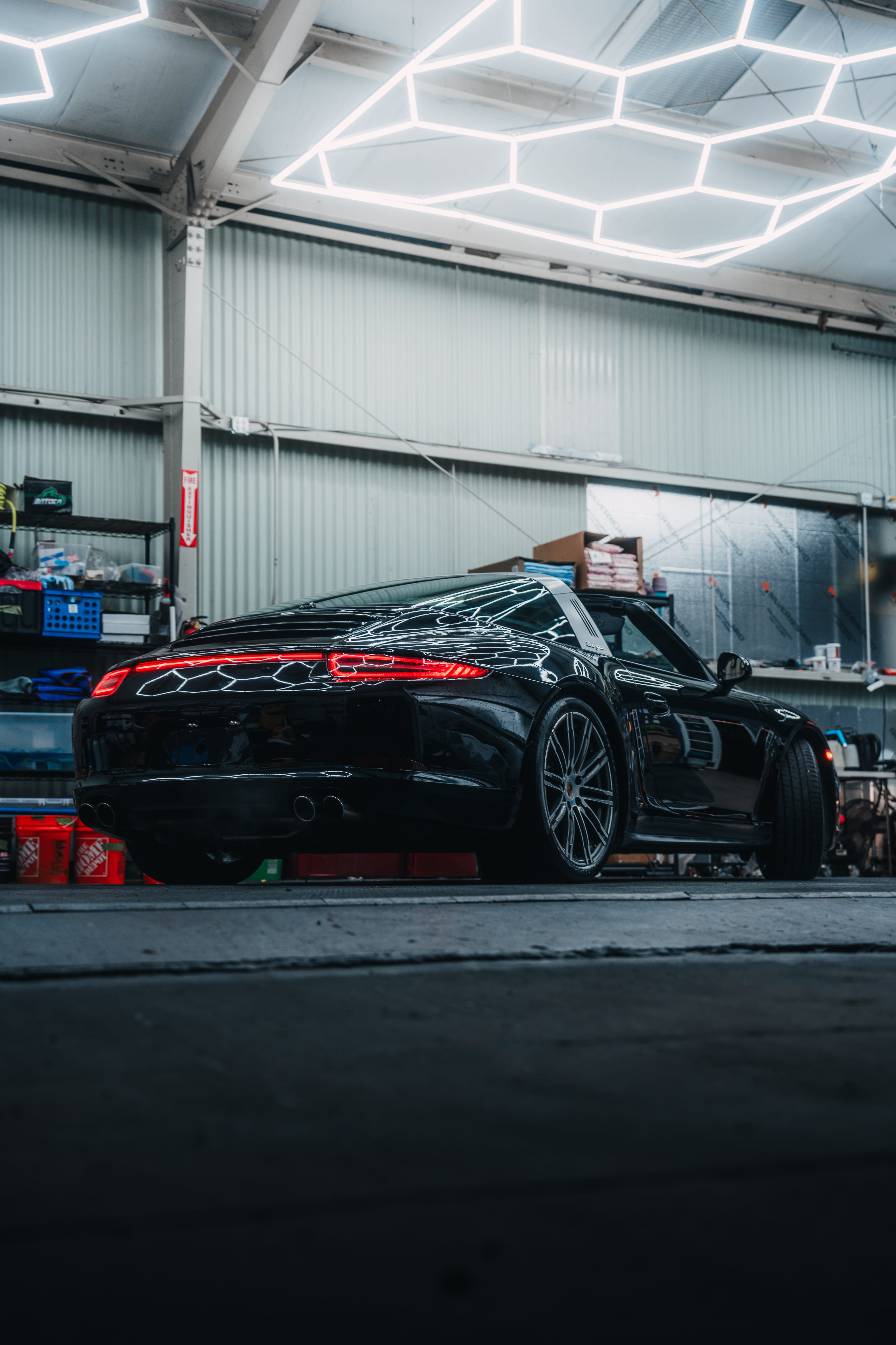 Rear three-quarter view of a black Porsche 911 Targa at Dragon Auto in Milpitas